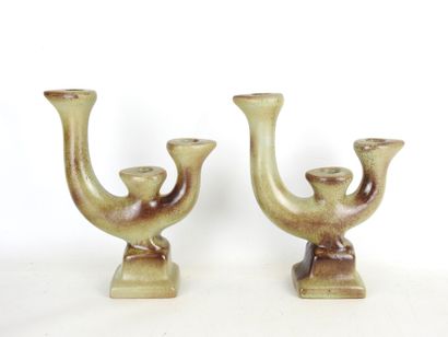 Pair of grey-brown glazed earthenware CANDLES...