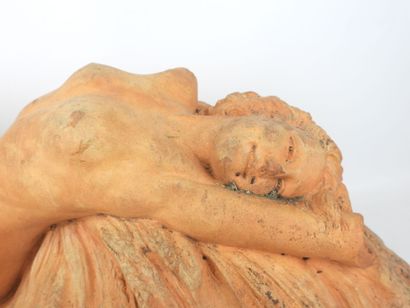 Nude woman lying on a sheaf of wheat, terracotta....