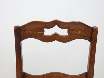 PAIR OF CHAIRS in carved wood, the seat covered...
