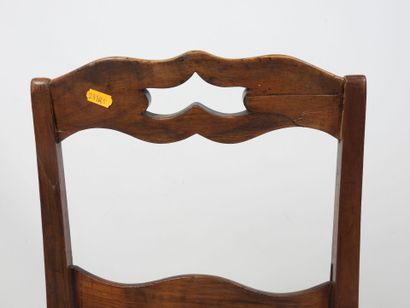 PAIR OF CHAIRS in carved wood, the seat covered...