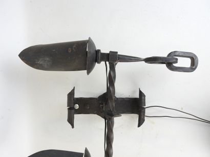 Wrought-iron sconce with two arms forming...