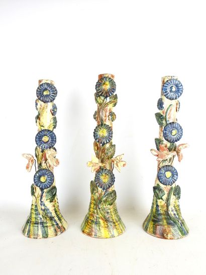 POPULAR ART: Three glazed terracotta candleholders...
