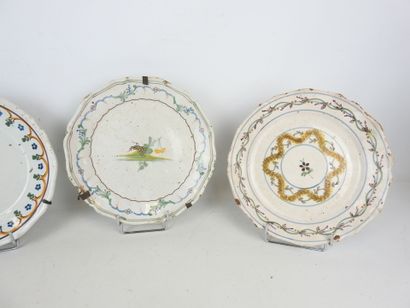 CENTER: Three earthenware plates with floral...