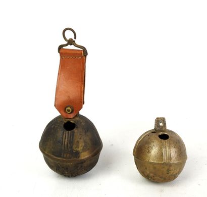 TWO bronze GRELOTS, one decorated with horses,...