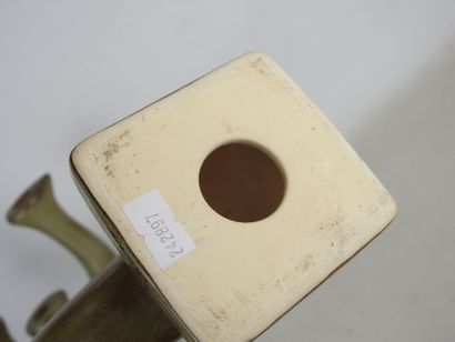 Pair of grey-brown glazed earthenware CANDLES...