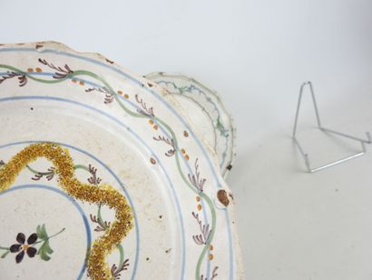 CENTER: Three earthenware plates with floral...
