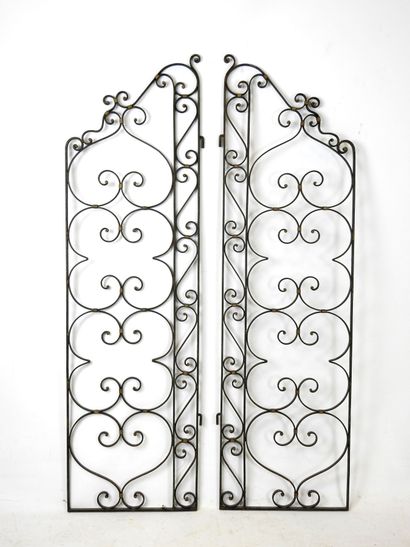 PAIR of black-tinted and gilded wrought-iron...