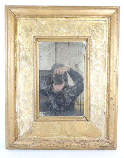 Gilded stuccoed wood mirror with incised...