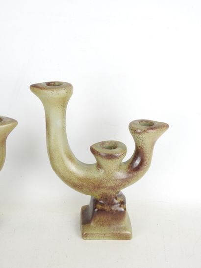 Pair of grey-brown glazed earthenware CANDLES...