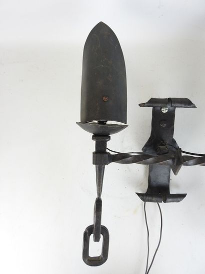 Wrought-iron sconce with two arms forming...