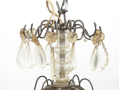 Iron chandelier with six arms adorned with...