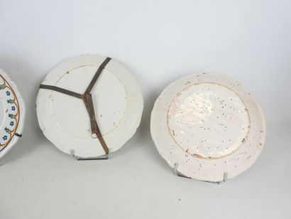 CENTER: Three earthenware plates with floral...