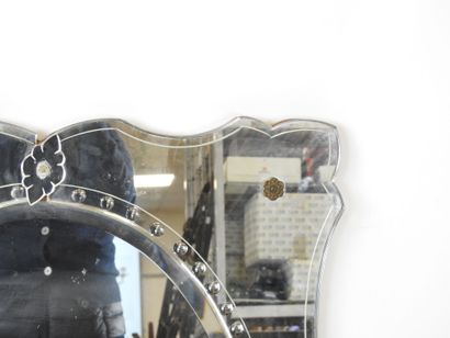 Venetian glass mirror with curved edge and...