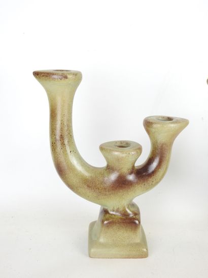 Pair of grey-brown glazed earthenware CANDLES...