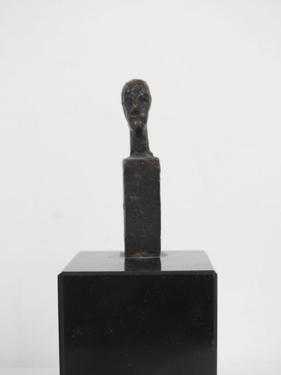 - Head of a man. Brown patina bronze sculpture...