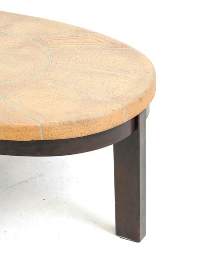 LOW TABLE with oval top in sandstone tile...