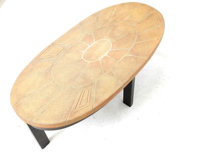 LOW TABLE with oval top in sandstone tile...