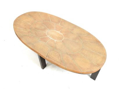 LOW TABLE with oval top in sandstone tile...