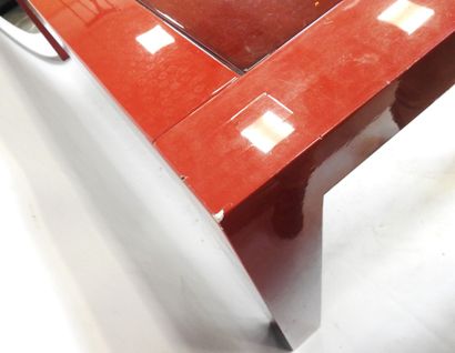 Rectangular table in red lacquer. Modern...