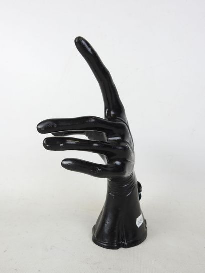 HAND wearing a fine black lacquered metal...