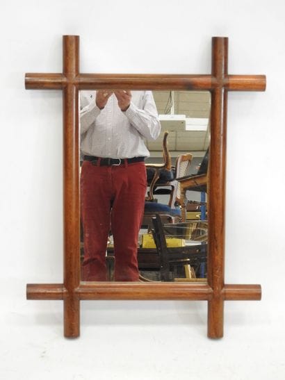 Rectangular mirror with wood surround. Work...