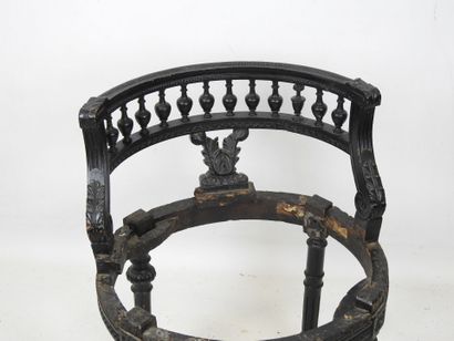 A black lacquered wood child's chair with...