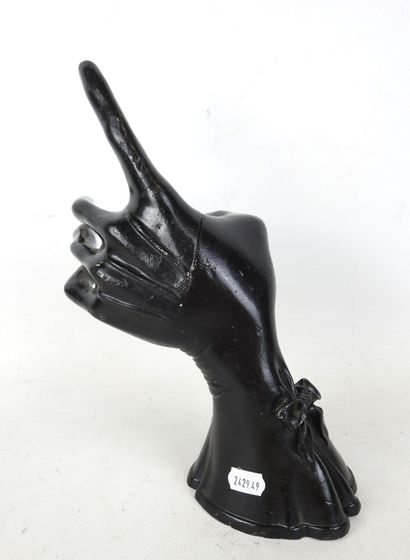 HAND wearing a fine black lacquered metal...