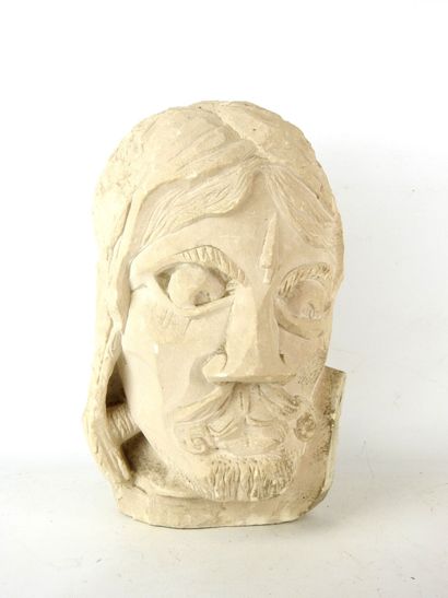 MAN'S HEAD in carved stone. H: 32 cm. Wear...