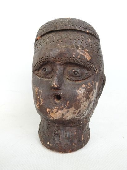 FACE of a blower in terra cotta with brown...