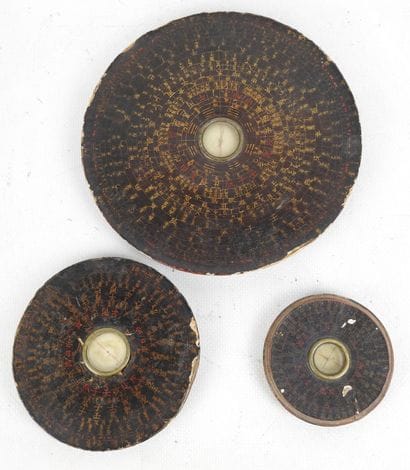 CHINA: Three brown lacquered wood compasses...