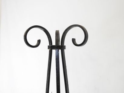 LAMP STAND in wrought iron resting on a tripod...