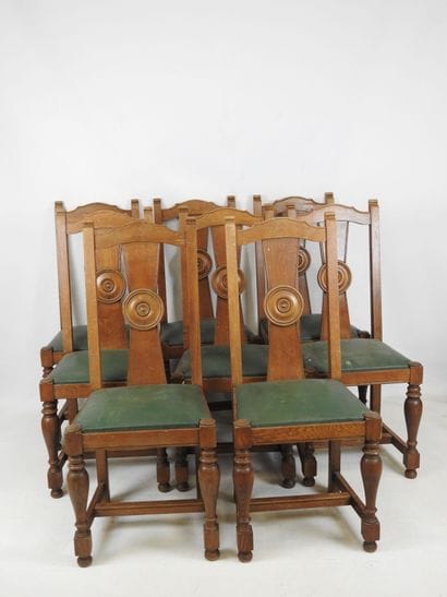 EIGHT wooden CHAIRS resting on four baluster...