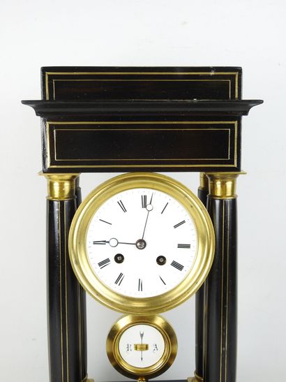 Black lacquered wood and gilt brass portico...