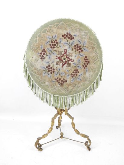 Gilded, twisted wrought-iron tilt-top GUERIDON,...