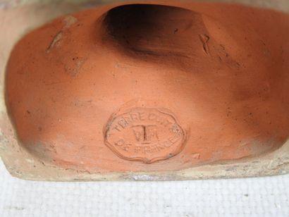 FEMALE à l'Antique styling her hair, terracotta...