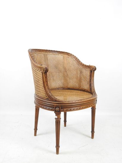 Walnut caned armchair, molded and carved...