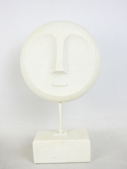 FACE sculpted from a block of plaster. Signed...