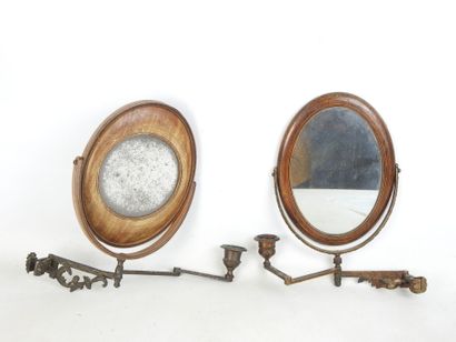 TWO double wooden mirrors resting on an articulated...