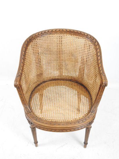 Walnut caned armchair, molded and carved...