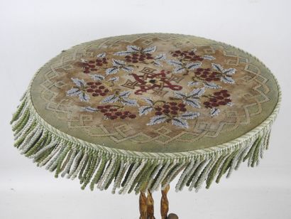 Gilded, twisted wrought-iron tilt-top GUERIDON,...