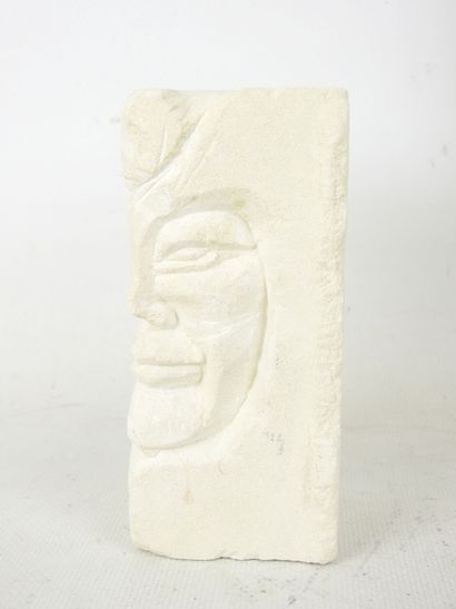 FACE sculpted from a block of plaster. Signed...