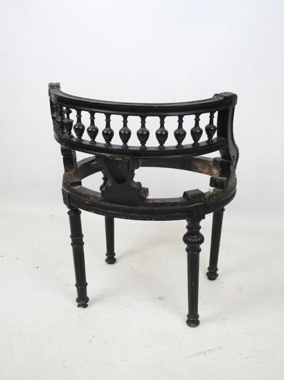 A black lacquered wood child's chair with...