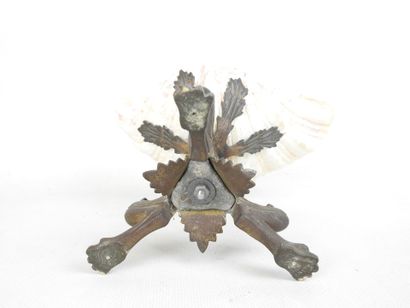 CUP resting on three regule claw feet supporting...