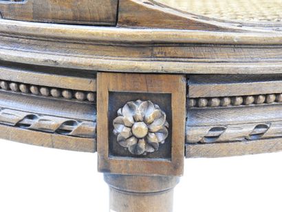 Walnut caned armchair, molded and carved...