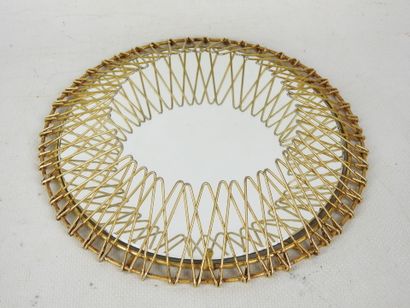 Circular gilded metal mirror in the shape...