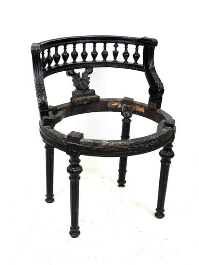 A black lacquered wood child's chair with...