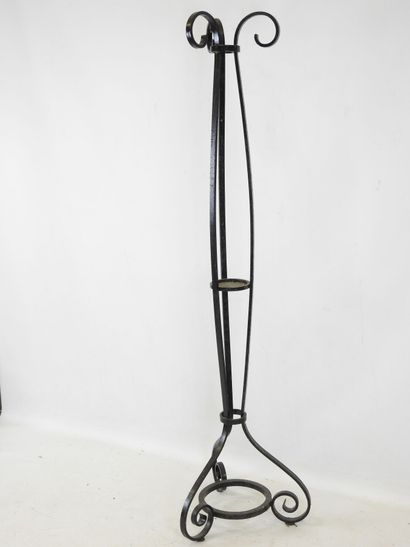 LAMP STAND in wrought iron resting on a tripod...