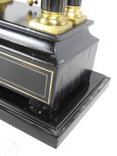 Black lacquered wood and gilt brass portico...