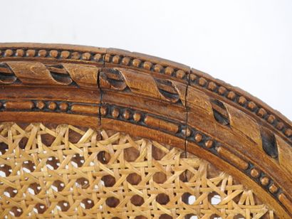 Walnut caned armchair, molded and carved...