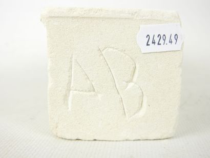 FACE sculpted from a block of plaster. Signed...